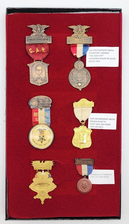 GAR Encampment Medals & DVCW Medal: GAR Encampment Medals & Daughters of Veterans of the Civil War Medal. The medals are from various places in Indiana including Evansville, Frankfort, Marion, and Lafayette. Also one from Massachusetts.