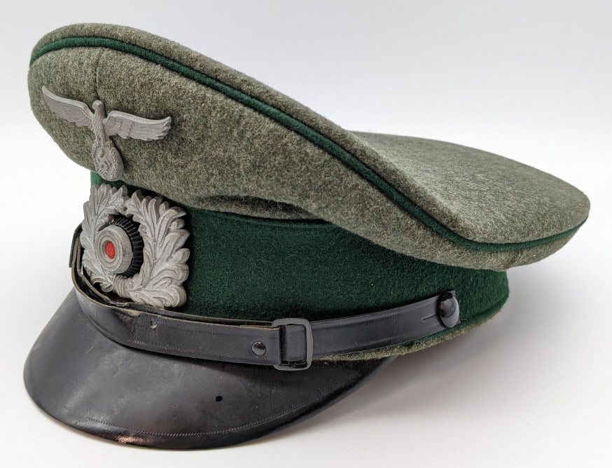 WW2 German Heer Dress Cap by Clemens Wagner: WW2 German Heer Dress Cap by Clemens Wagner. Cap is in very nice condition with the wreath badge and german eagle and swastika. The inside liner is marked with the manufacturer Clemens Wagner and is s