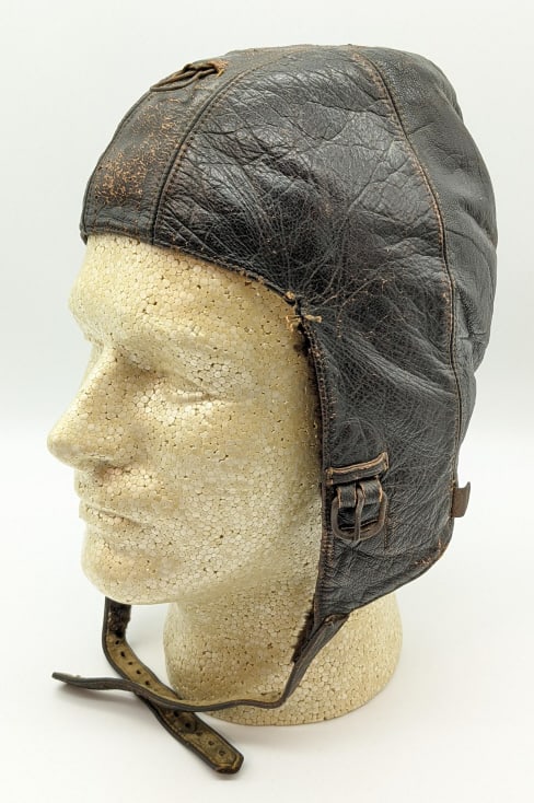 WW2 German Luftwaffe Leather Aviation Cap: WW2 German Luftwaffe Leather Aviation Cap. Cap is in nice aged condition with all of its buckles and straps, wool lining, and nice patina. The inside is marked with the manufacturer Nuemann E Leymar.
