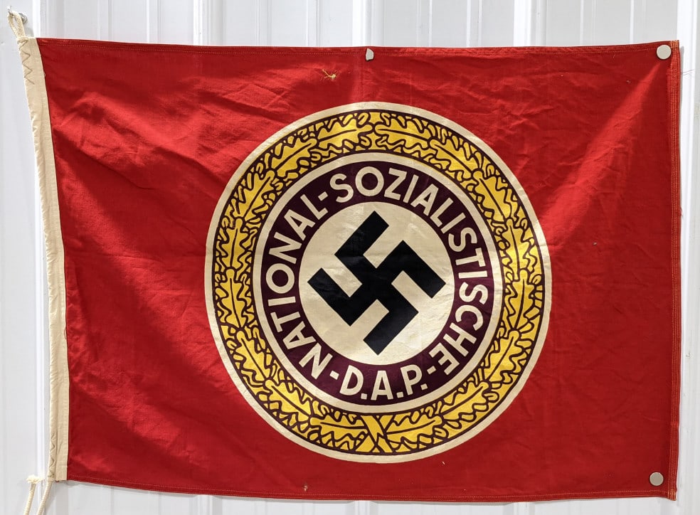 WWII German Third Reich NSDAP Cloth Flag: WWII German Third Reich NSDAP Cloth Flag. Flag appears to be in very good condition with some discoloration and wear from age. It is marked "60 x 90" , "Walter Buch", and "Alten Garde". Measures 35in 