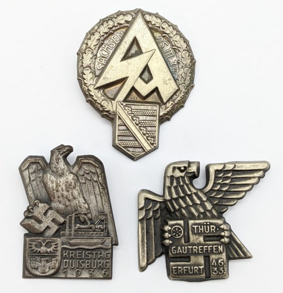 3) WW2 German Tinnie Rally & NSDAP Badges: 3) WW2 German Tinnie Rally & NSDAP Badges. Badges are for the SA rally in Sachsen, the rally for Gau Treffen, Erfurt, and for the NSDAP factory Kreistag Duisburg. All badges are in nice condition with