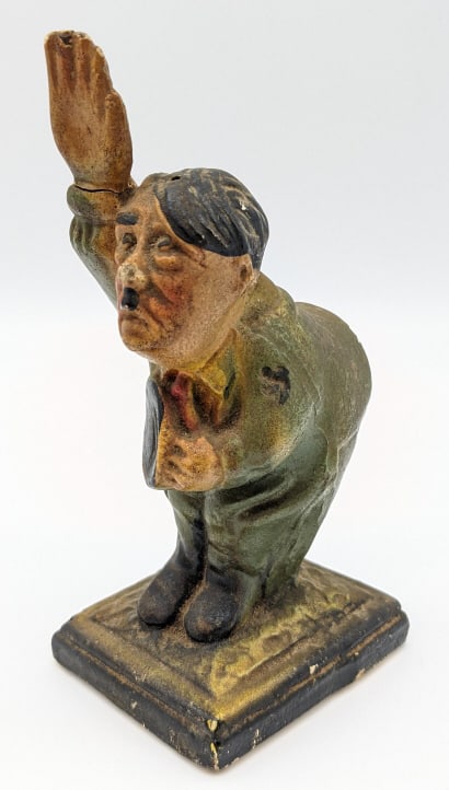 WW2 Ceramic Anti-Hitler Pin Cushion: WW2 Ceramic Anti-Hitler Pin Cushion. The piece is missing the cushion portion of the pin cushion and his hand has been glued back on. Still displays well as a decorative piece with nice paint and pati