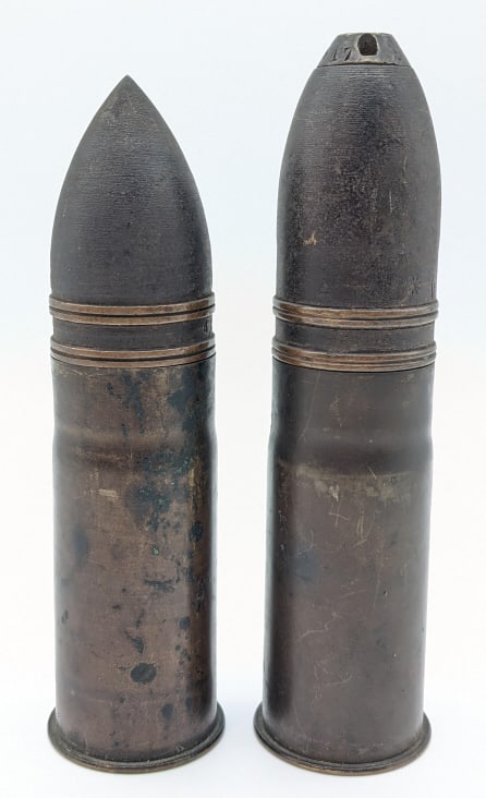 WW1 37mm Deactivated Rounds: WW1 37mm Deactivated Rounds. One round is a high explosive with removable tip and the other is an armor piercing round. Rounds are in nice condition and display well as a pair. Largest measures 6-1/2i