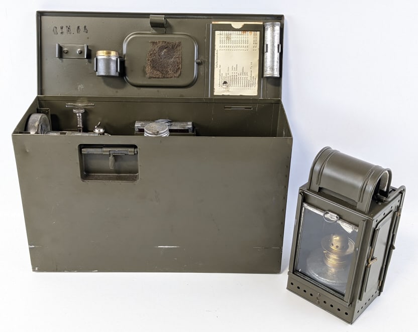 WW2 German Signal Lantern Kit w/ Case: WW2 German Signal Lantern Kit w/ Case. Kit includes additional lenses, kerosene wick, candles, & reflector. All pieces are in very nice condition with some light wear from use and age. Case measures 1