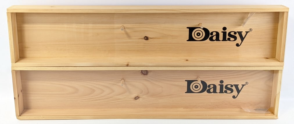 2) Daisy Wooden Wall Display Cases w/ Plexi Front: 2) Daisy Wooden Wall Display Cases w/ Plexi Glass Front. One of the displays has a corner of the plexi glass that is broken. Measures 38in x 8-1/4in x 2-3/4in.