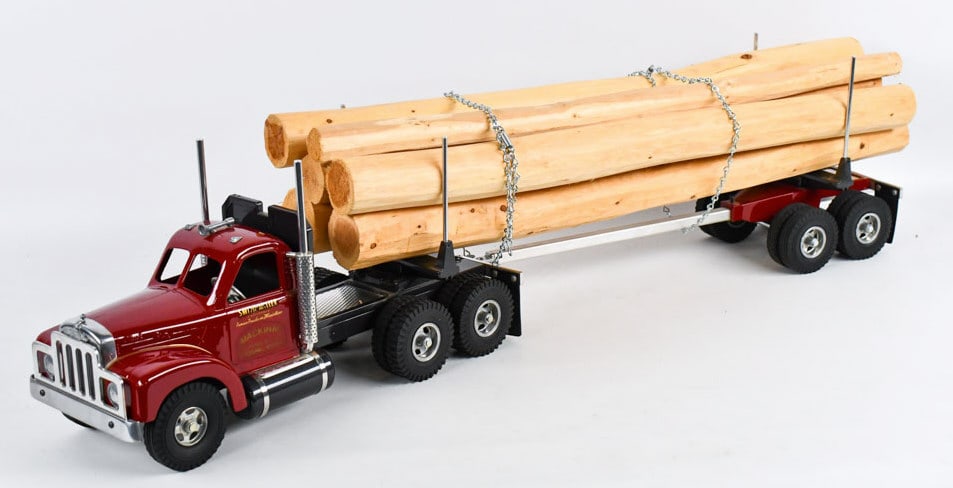 Fred T. Smith Miller Mackinac Log Hauler Semi: Fred Thompson Smith Miller B Mack Mackinac Logging Works truck and trailer. Displays well with realistic load, B Mack cab, and chrome features. Good condition with the foam lined box. Limited edition