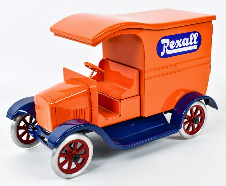 Cowdery Toy Works Rexall Drugs Delivery Truck: Cowdery Toy Works Rexall Drugs delivery Flivver truck. Displays well with bright colors and spoked wheels. Good condition with a knick to the one decal and some very small paint chips on the running b