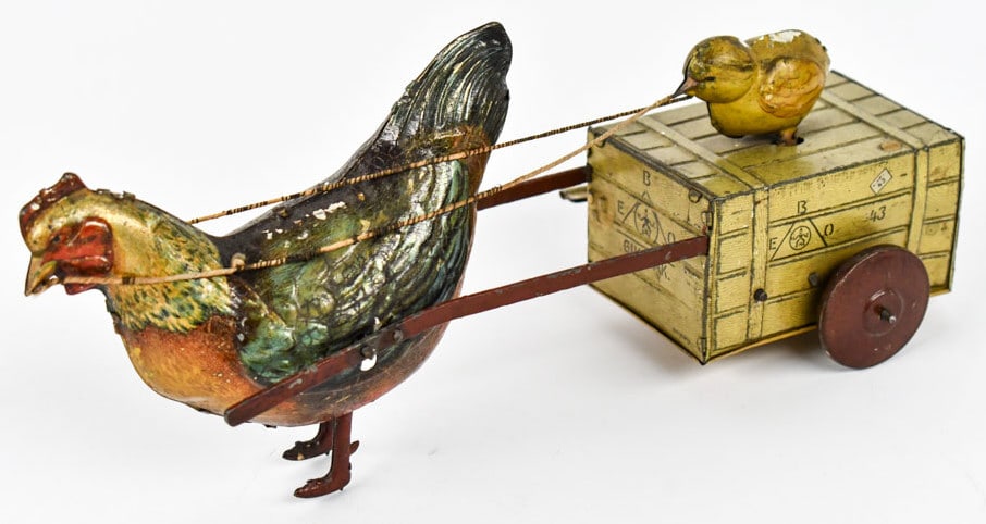 Hans Eberl Tin Gik-Gak Rooster Pulling Chick: Hans Eberl tin windup Gik-Gak rooster pulling cart with baby chick. The windup mechanism works, but needs some help. The baby chick squeeks and moves back and forth. The rooster has a hard time moving