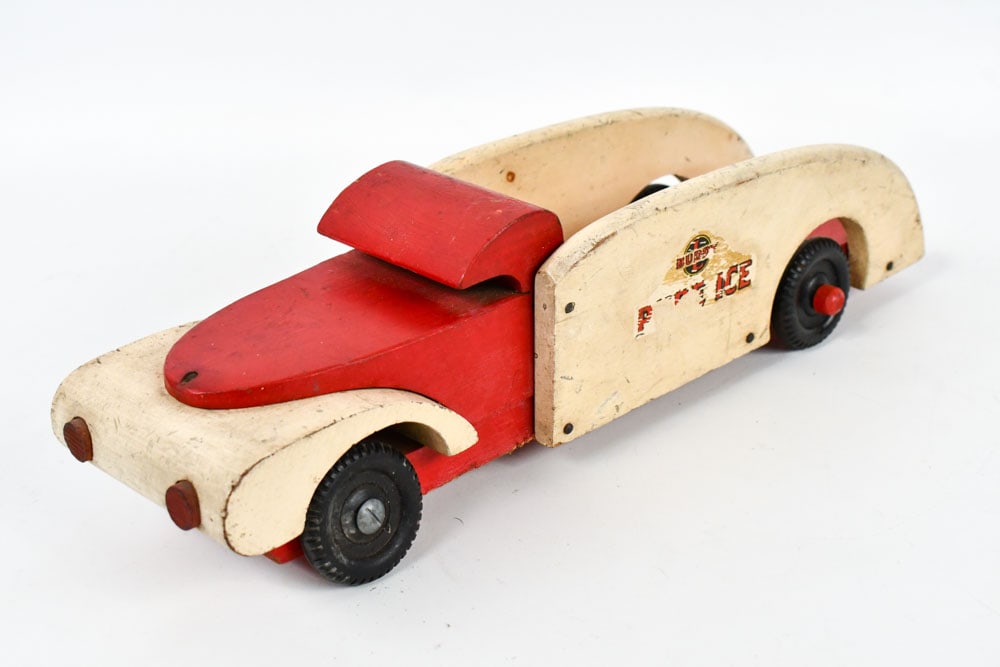 Buddy L Wood Toys Pure Ice Truck: Buddy L Wood Toys WWll era wooden pure ice truck. The truck is missing one of the axle caps. The truck has some decal loss, paint loss, and wear from play and age. Meausres approximately 16" long.
