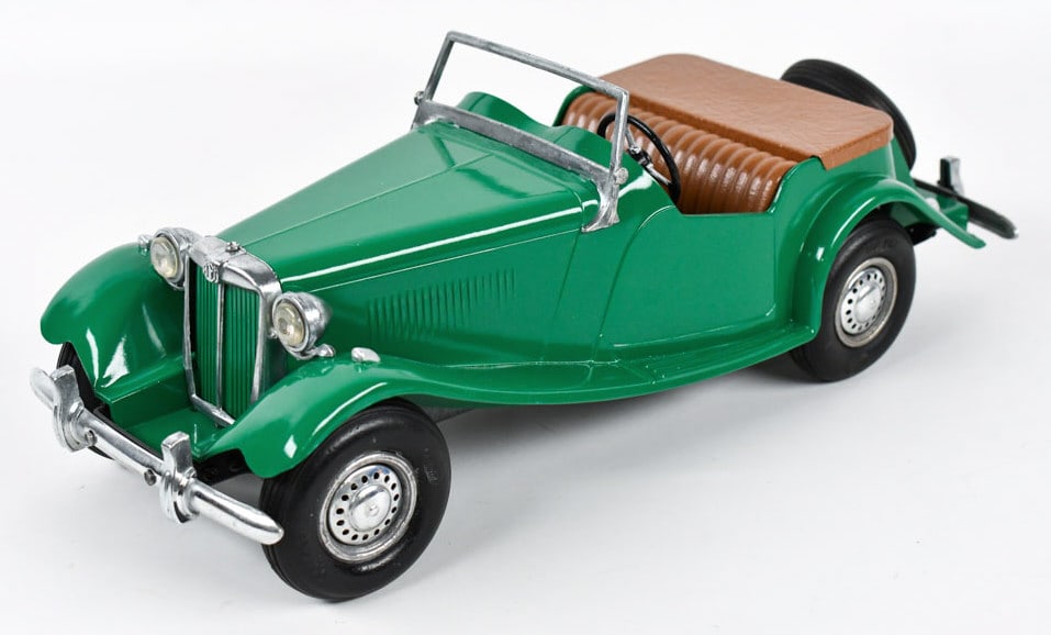 Restored Doepke Model Toys MG Roadster Car: Restored Doepke Model Toys MG Roadster convertible car. Displays well with windshield, headlights, and spare tire. Good restored condition. Measures approximately 15" long.