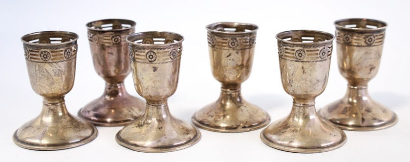 6 Pc. Webster Sterling Silver Egg Cups: Set of six Webster sterling silver egg cups. The cups stand 3" tall and are in good condition, they need a polishing. Total sterling silver weight is approx. 5.25 troy ounces.