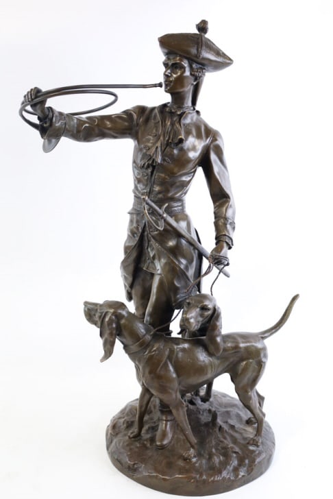 Bronze Bugle Boy With Two Hound Dogs Statue: Nicely detailed bronze statue after Auguste Moreau. The bronze features a colonial Boy with a bugle holding two hound dogs by a leash. Measures approx. 25" tall x 15" across x 14" deep, signed on the