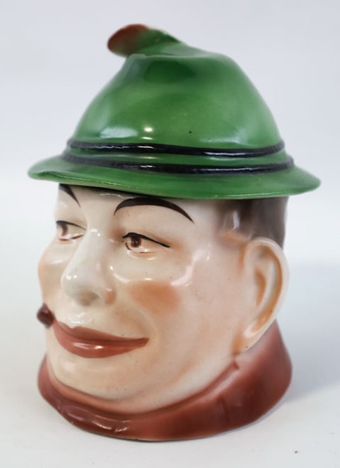 Austrian Man With Hat Porcelain Tobacco Jar: Antique Austrian Man with Hat Tobacco Jar Humidor. The jar has nice hand-painting and is in good condition with some light hairlines. Measures 5-1/2" tall x 4-1/2" across.