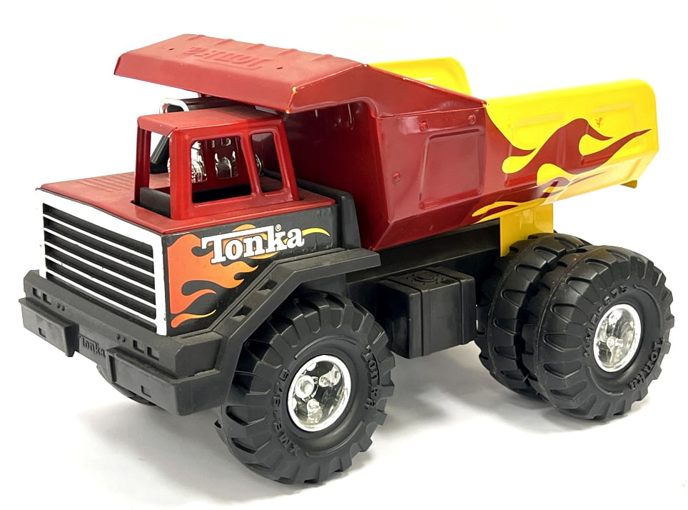 1990's Tonka Mighty Blaze Dump Truck Toy: 1990's Tonka Mighty Blaze Dump Truck Pressed Steel and Plastic Toy. This truck displays nicely with almost no scratches and wear. It is in good condition and all parts are in working condition. Measur