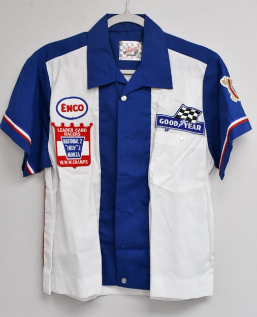 Bobby Unser's Leader Card Team Shirt: Bobby Unser joined Leader Card racing during the summer of 1966. The Leader Card Team was well established with two wins at Indianapolis, plus a win at Monza. Bobby's first win for the Wilke family te