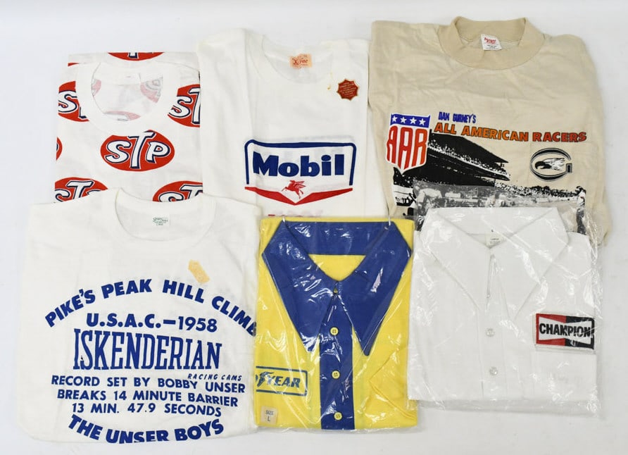 (6) Vintage Bobby Unser T-Shirts: Offered is a Lot of 6 Bobby Unser Vintage Shirts. Shirts include the following:Goodyear Polo shirtChampions Spark Plug Polo shirt1963 Pikes Peak Hill Climb shirtDan Gurney's Al American Racers shirt19