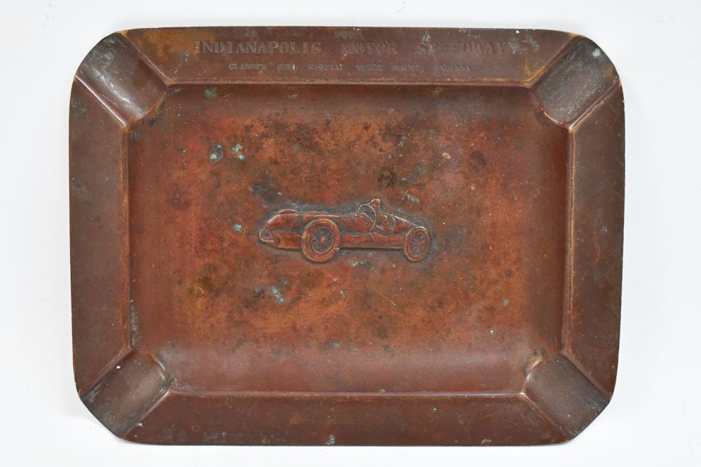 1939 Indianapolis 500 Clabber Girl Special Ashtray: 1939 Indianapolis 500 Wilbur Shaw Clabber Girl Special bronze ashtray. Appears to be in good ocndition with toning and wear from use and age. It measures approximately 6-1/2" across by 5" tall.