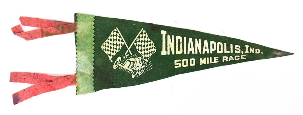 1930s-1940s Indianapolis 500 Mile Race Pennant: 1930s-1940s Indianapolis 500 Mile Auto Race pennant. Has discoloration / staining, and wear from age. It measures approximately 11" across (not including tassels).