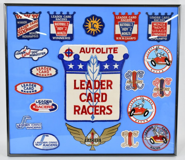 Vtg Leader Card Racers Patch / Decal Collection: Vintage Leader Card Racers patch and decal collection frame dbehind glass.Items appear to be in nice condition with light wear from display and age. Overall with frame it measures approximately 24" ac