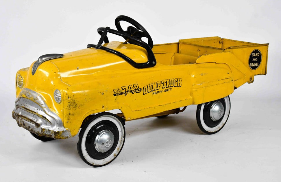 Original Yellow Murray Sand & Gravel Dump Truck: Original Murray No. 742 jet flow drive sand and gravel dump truck. The truck is in overall nice original condition with paint loss, scratches, and wear from use and age. The rear bed dumps. Displays w