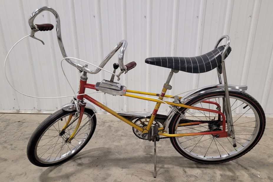 Vintage Western Flyer The Wild One III Bike: Vintage Western Flyer "The Wild One" muscle bike. The bike is equipped with front and rear brakes, 3 speed shifter, and chrome features. The bike does have paint loss, oxidation, and wear from age.