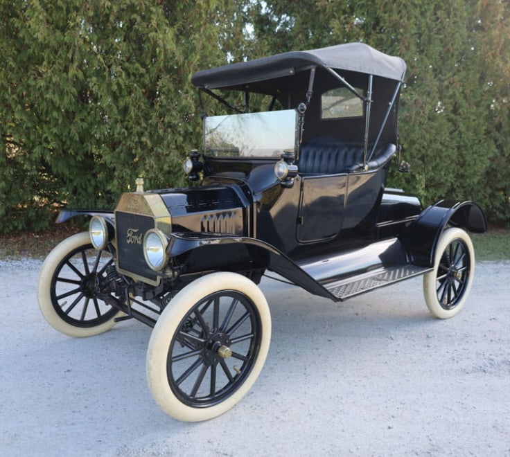 1915 Ford Model "T" Roadster: - 4 cylinder hand crank engine- Model T transmission with forward, reverse, and brake pedals- 2 door, 2 seat roadster with convertible top- White slick tires- Well maintained older restoration- Clear