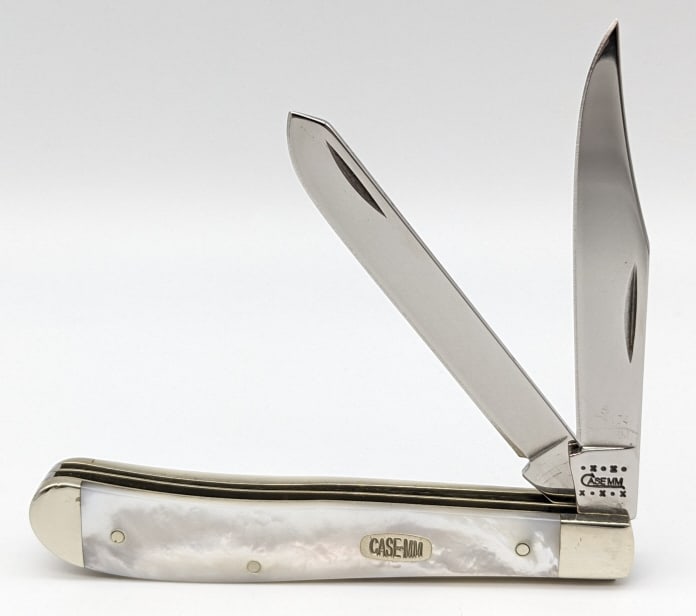 2000 Case XX Millennium MoP Slimline Trapper: 2000 Case XX Millennium Mother of Pearl Slimline Trapper 82048. Knife is numbered 174 of 500 and is in like new condition. Knife measures 4-1/8in when closed.