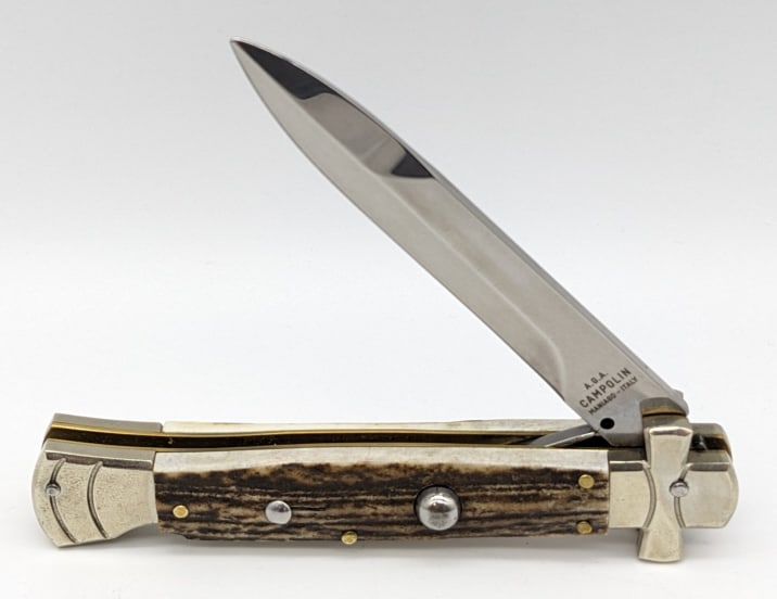 A.G.A. Champolin Stag Stiletto Switchblade Knife: A.G.A. Champolin Stag Stiletto Switchblade Knife. Knife is in very nice condition and features a single edged blade, integral guard bolster, and stag handle scales with lock back design. Blade spring