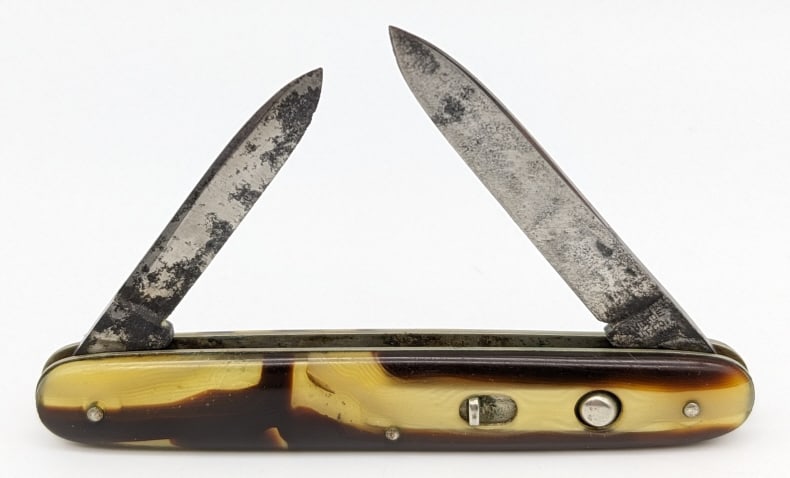 Schrade Cut Co Marbled Double Switchblade: Schrade Cut Co Marbled Double Switchblade Knife. Knife is in aged condition with carbon spotting and wear. Both blade springs are strong and have very little play when open. Measures 3in when closed.