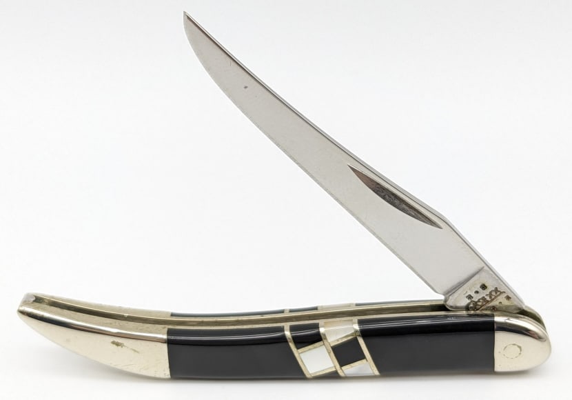 2002 Case XX Exotic Tiny Toothpick EX10096 w/ Box: 2002 Case XX Exotic Tiny Toothpick EX10096 w/ Box. Features slick black and checkered mother of pearl handle scales. Knife is in very nice condition with some light wear on the bolsters from handling.
