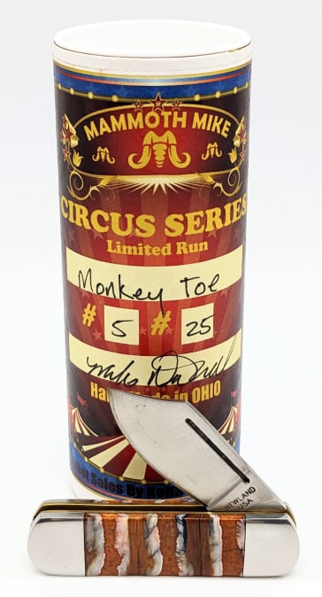 Ltd Mike Newland Custom Monkey Toe Mammoth Knife: Ltd Mike Newland Custom Monkey Toe Mammoth Tooth Knife w/ Packing Tube. Features a clip point blade, orange dyed mammoth tooth handle scales, and is 1 of 20. Knife is in new condition. Overall length 