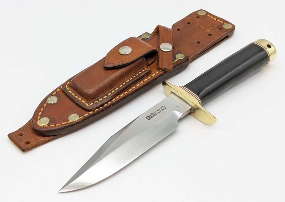 Randall Model 15 Airman Knife w/ FW Byrd Sheath: Randall Model 15 Airman Knife w/ FW Byrd Sheath. Features a nickel double downturned hilt, black micarta handle, and nickel butt cap with wrist thong hole. Knife is in near new condition with minimal 