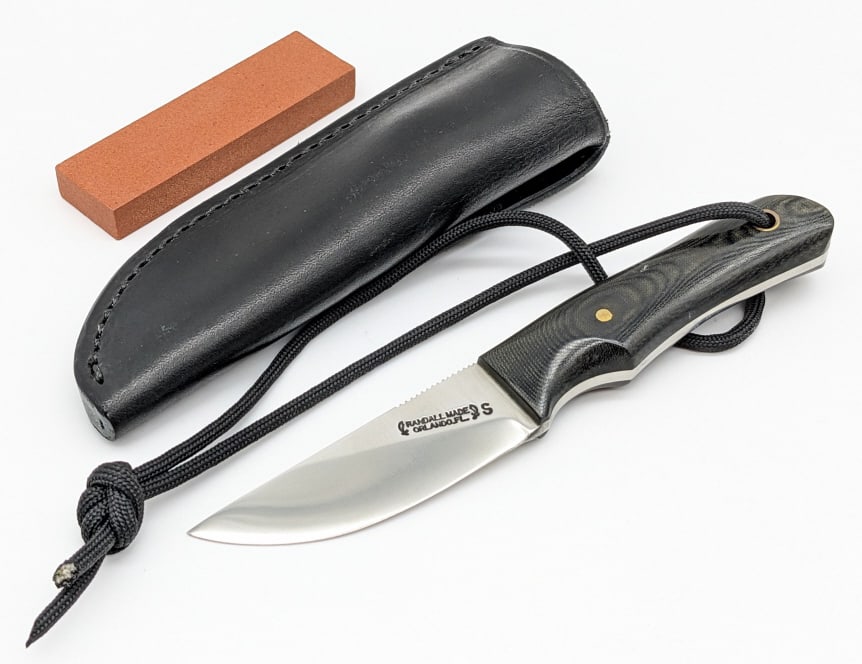 Randall Model 10 Straight Back Utility Knife: Randall Model 10 Straight Back Kitchen Utility Knife w/ Randall Sheath & Sharpening Stone. Features a stainless steel blade with thumb notches, and full tang black micarta handle with wrist thong hole