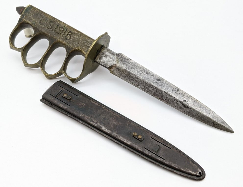 WW1 US Model 1918 AU Lion Cast Brass Knuckle Knife: WW1 US Model 1918 AU Lion Cast Brass Knuckle Knife w/ L.F. & C. Scabbard. Knife is in nice aged condition with some of original black finish left on minimally worn blade and spike pommel. Upturned han