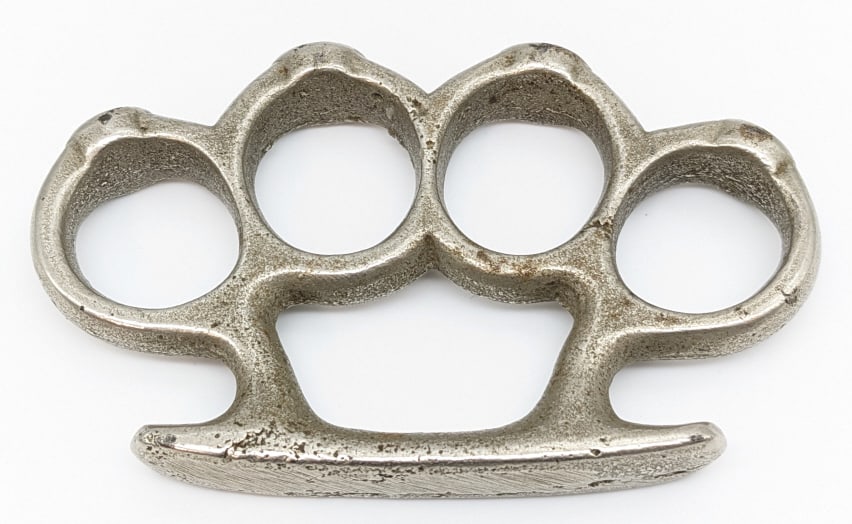 Vintage Studded Brass Knuckle Dusters: Vintage Studded Brass Knuckle Dusters. Knuckles are in nice condition with some wear from age. Measures 4in across. Please check your local laws before bidding. We will not ship to areas where these a