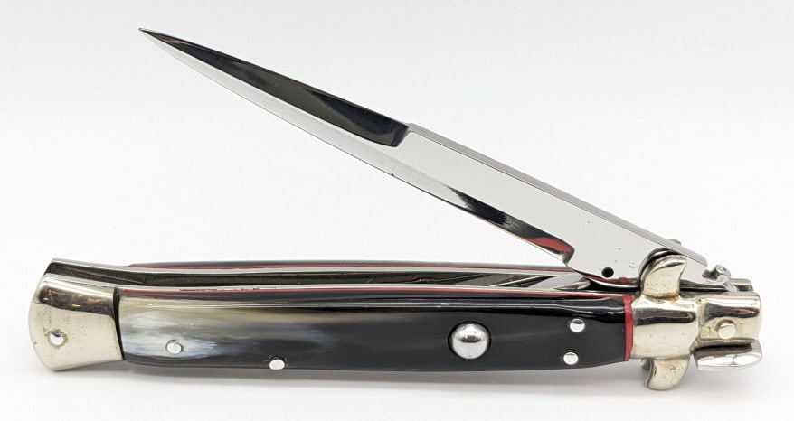 George Cameron Custom Large Stiletto Switchblade: George Cameron Custom Large Stiletto Switchblade. Knife is in very nice condition with a polished blade, nickel silver bolsters, nice black polished horn handle scales, and picklock locking design. Bl