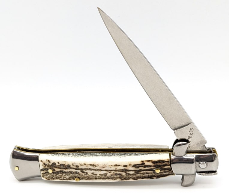 Indiana Cutlery Italian Stiletto Switchblade Knife: Indiana Cutlery Italian Stiletto Switchblade Knife. Features a unique swing guard firing mechanism. A group of these knives were discovered in a warehouse in Maniago Italy, and were made by Frank Belt