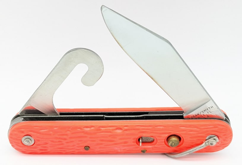 Logan / Smyth MC1 Orange Paratrooper Switchblade: Logan / Smyth MC1 Orange Paratrooper Switchblade. Knife is in very nice condition with minimal wear, and orange plastic handle scales. Blade spring is strong, and has a little play when open. Overall 