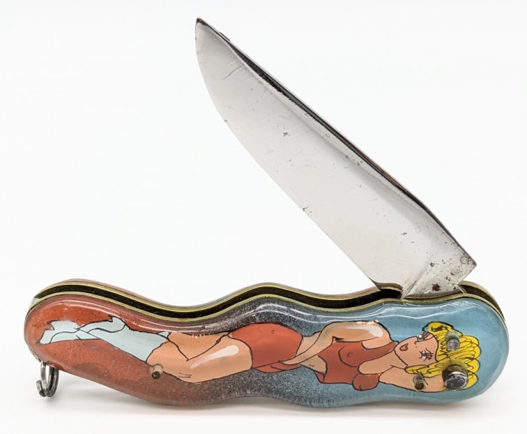 RPK Russian Prison Knife Pin-Up Girl Switchblade: RPK Russian Prison Knife Pin-Up Girl Switchblade. These knives were made in Russian prisons by prisoners. This one features the front and back side of a pin-up girl under acrylic. Knife is in good con
