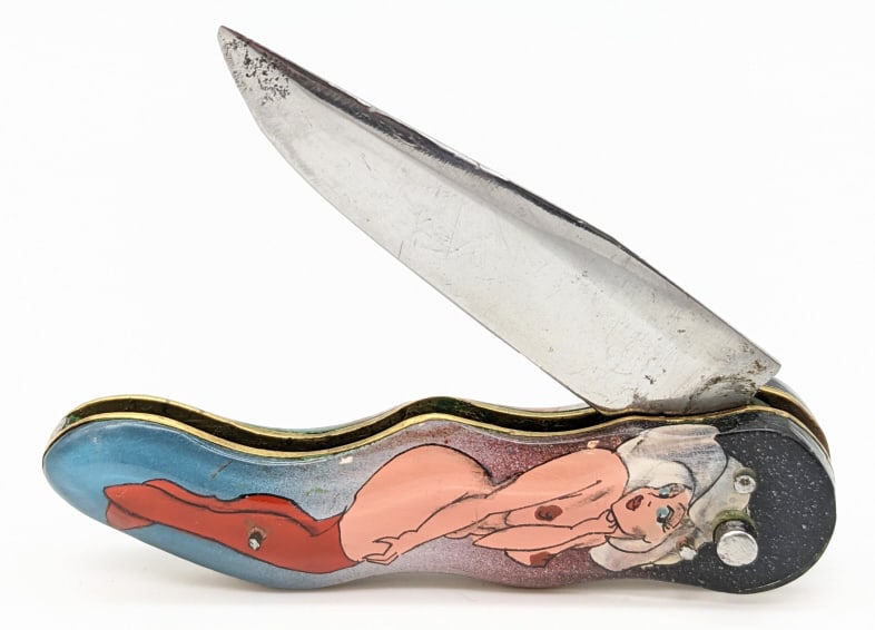 RPK Russian Prison Knife Pin-Up Girl Switchblade: RPK Russian Prison Knife Pin-Up Girl Switchblade. These knives were made in Russian prisons by prisoners. This one features the front and back side of a nude pin-up girl under acrylic. Knife is in goo