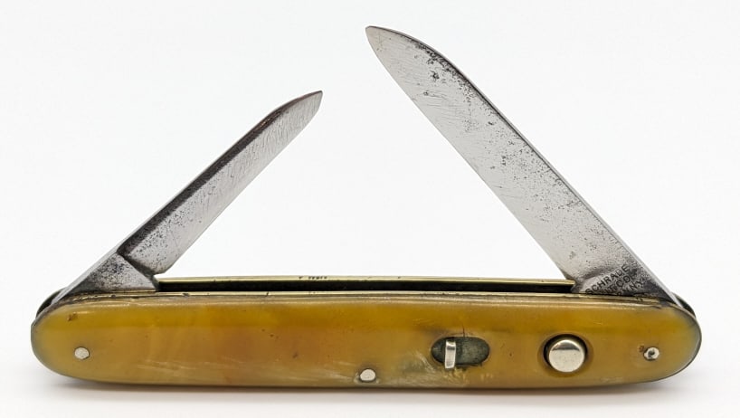 Vtg Schrade Cut Co 2 Blade Switchblade Knife: Vtg Schrade Cut Co 2 Blade Switchblade Knife. Knife is in used condition with polished blades with scratches and some pitting, and discolored marbled white plastic handle scales. Both blade springs ar