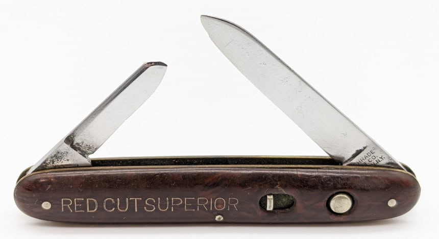Vtg Schrade Cut Co Advertising 2 Blade Switchblade: Vtg Schrade Cut Co Advertising 2 Blade Switchblade. Knife is in nice used condition with polished blades with light pitting, and marbled brown plastic handle scales with the name "Red Cut Superior". B