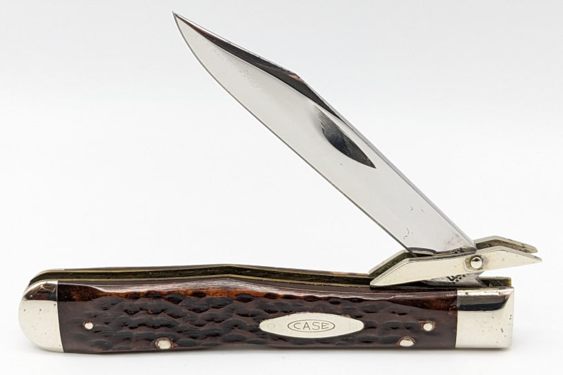1975 Case XX Jig Bone Cheetah Knife 6111 1/2: 1975 Case XX Jig Bone Cheetah Knife 6111 1/2. Knife is in very nice condition with a polished blade with light carbon spotting and appears to of never been sharpened, polished bolsters with some carbo