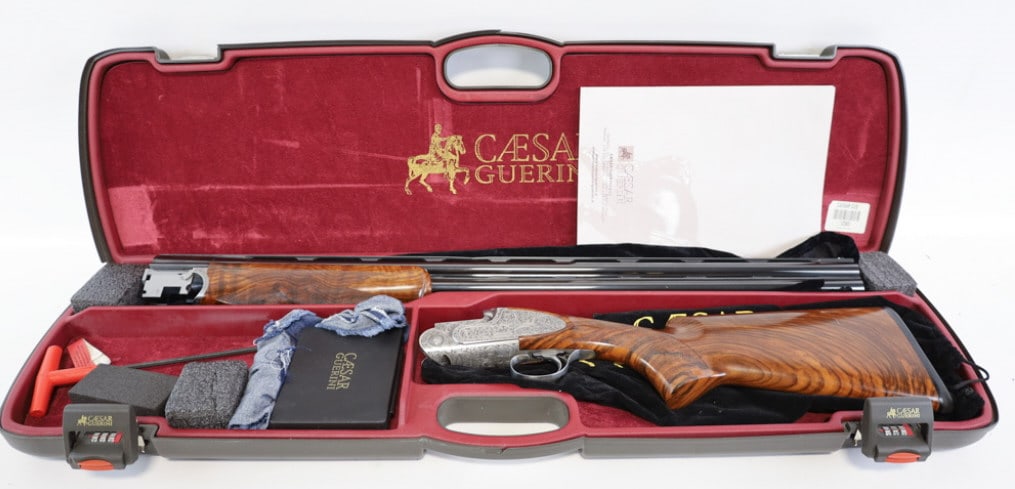 Caesar Guerini Maxum Collector Grade O/U Shotgun: Caesar Guerini Maxum Collector Grade 12 Ga O/U Shotgun. The Maxum is a true collector grade shotgun, featuring deep relief floral scroll hand finished engraving on the receiver, side plates, and forea