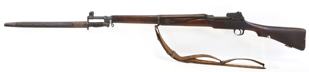 British Enfield Pattern P14 .303 Bolt Action Rifle: British Enfield Pattern P14 .303 Bolt Action Rifle. Comes with the leather scabbard bayonet and broken sling. Features a 26in barrel, and is marked with british proof marks. This rifle is part of a ba