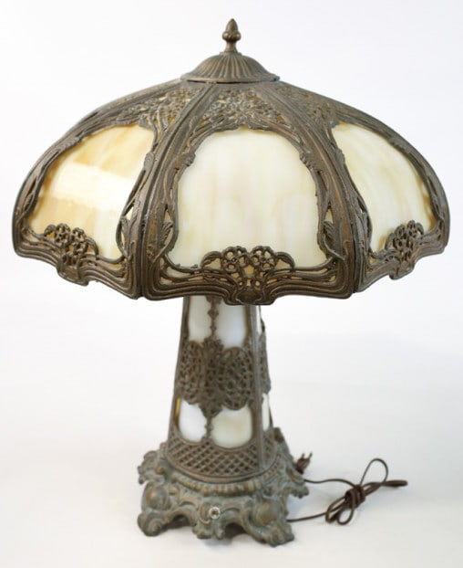 Antique 8 Panel Carmel Slag Glass Table Lamp: Antique 8 Panel Carmel Slag Glass Table Lamp with lighted base. The lamp is in good condition with age and use wear and has been rewired. Shade measures 20" in diameter and the lamp stands 24-1/2" tal