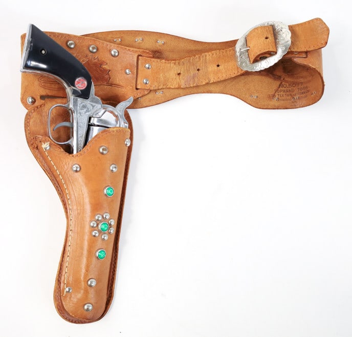 Nichols Stallion 45 Mark II Cap Gun With Gun Belt: Vintage Nichols Stallion 45 Mark II cap gun revolver with leather gun belt and holster. The revolver is not working properly and needs some repair. has some use wear. The revolver measures 12" long ov