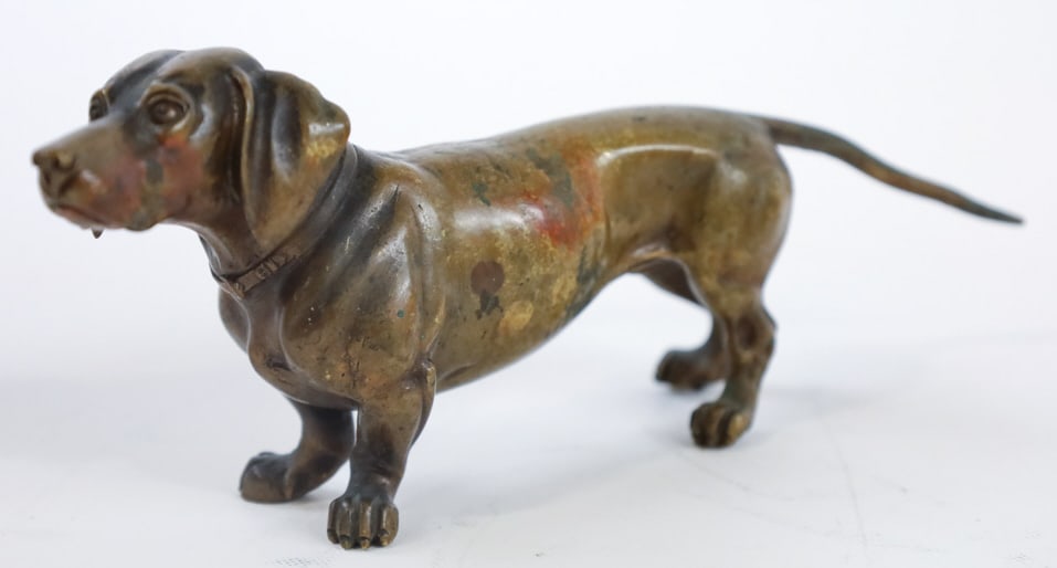 Antique Austrian Bronze Dachshund Sculpture: Very nice antique Austrian bronze sculpture featuring a standing Dachshund. Great quality and detail, marked Austria. Measures approximately 3-1/4" tall x 8" across x 2" deep.