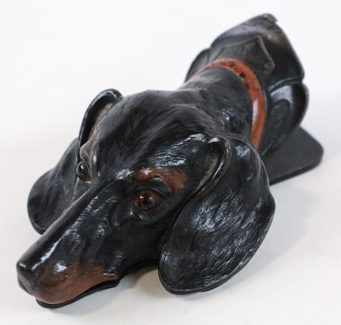 Antique Cast Iron Dachshund Head Wall Clip: Antique painted cast iron wall clip featuring the head of a Dachshund. Great quality and detail with glass eyes. Marked inside "Depose". Measures approximately 5-1/2" tall x 3" across x 1-7/8" deep. V