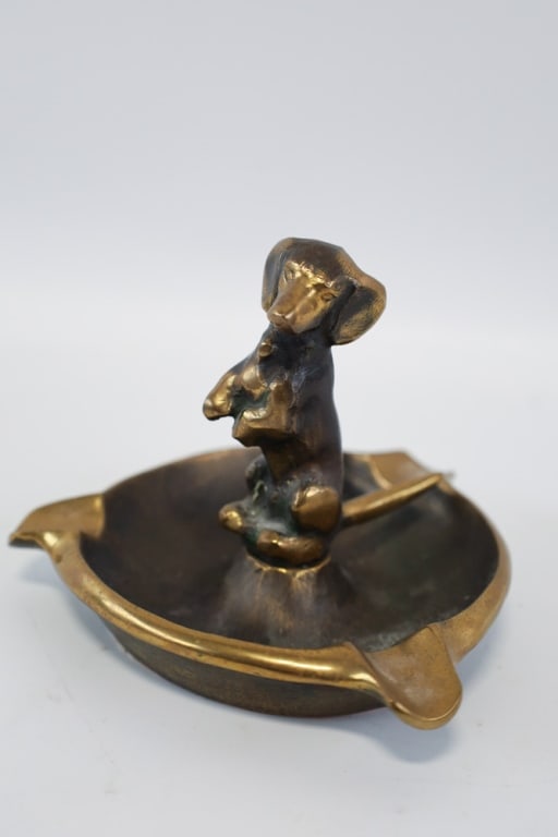 Vintage Brass Standing Dachshund Ashtray: Vintage brass standing Dachshund ashtray. Measures approximately 3-3/4" tall x 5" across x 4-1/2" deep. Nice condition.